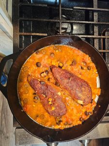Morrocan chicken tagine for soft and bite sized textures braising in pot