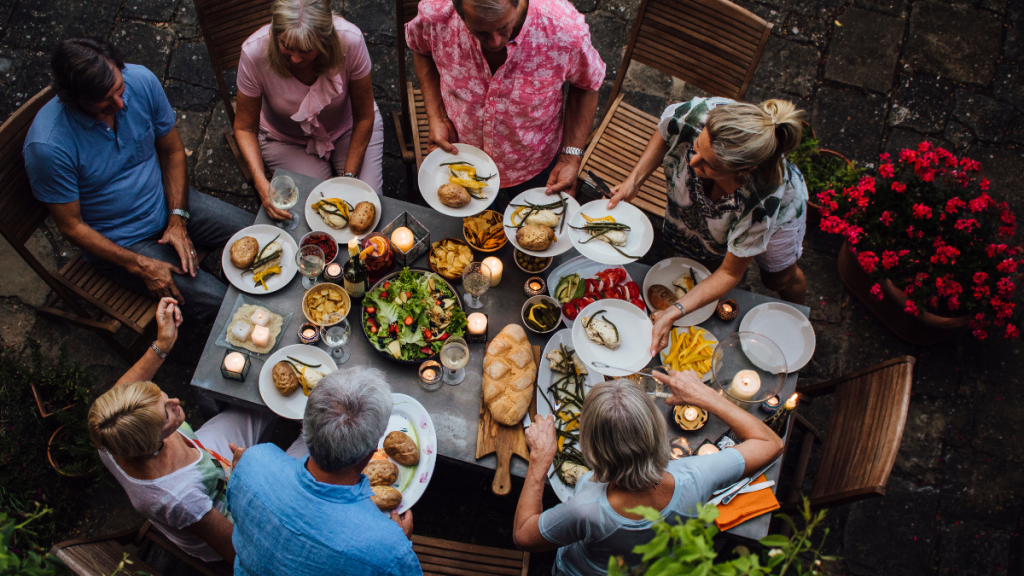 An overhead view of a dinner party sharing a meal