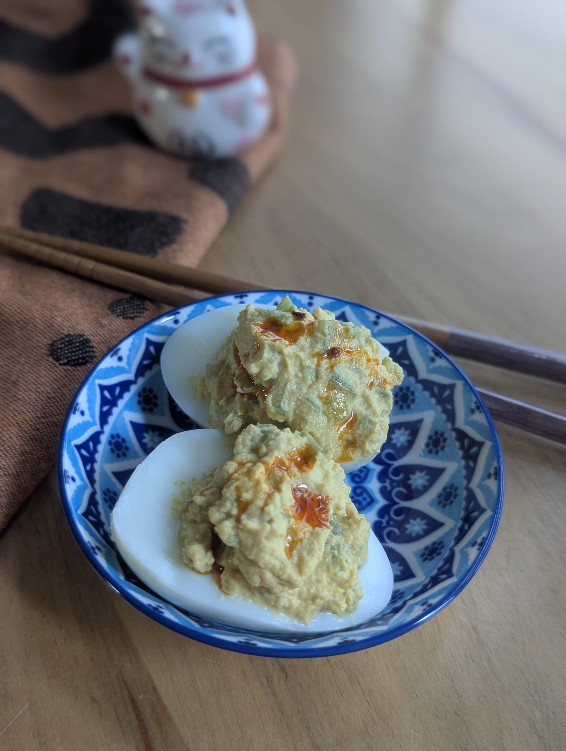 Easy to Chew Sesame cucumber deviled eggs plated with chopsticks